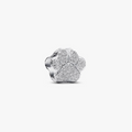 A silver four-petal flower charm with a textured pavé-like finish, shown on a plain light gray background.