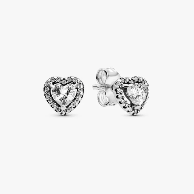 A pair of silver heart stud earrings with clear heart-shaped center stones and small surrounding clear stones, shown on a plain light gray background.