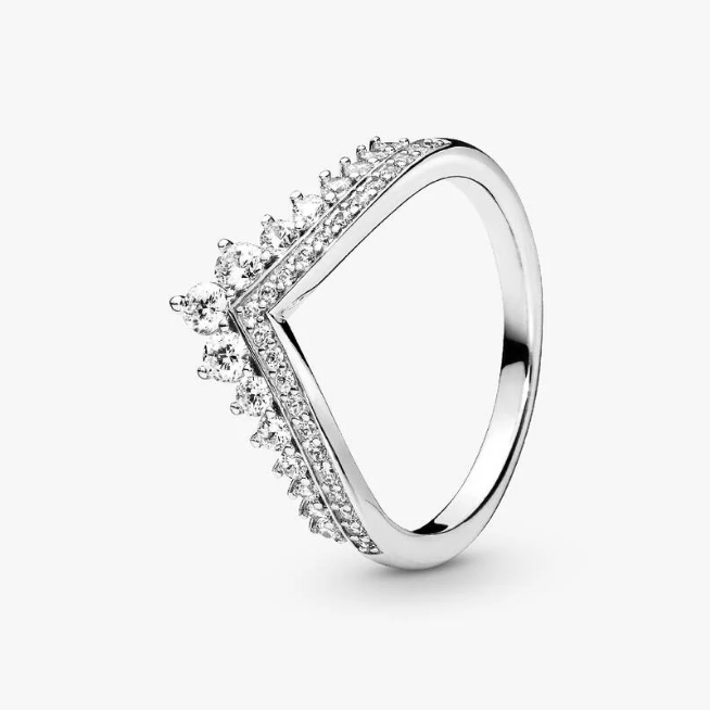 Silver ring with clear gemstones on a white background