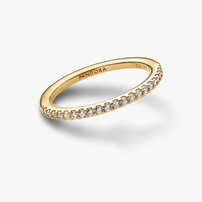 A gold Pandora ring with a half-pavé diamond band, shown on a clean white background with a soft shadow.