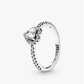 Pandora silver ring with a pear-cut center stone and small accent stones, shown on a light gray background.
