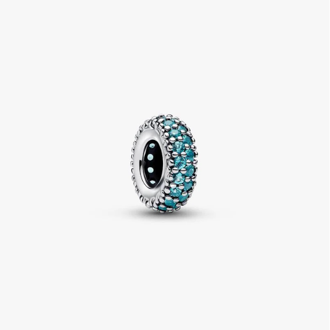 A silver charm bead featuring a black center surrounded by a border of small turquoise-blue and silver faceted stones, shown on a clean white background.