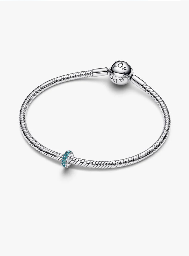 A silver-toned Pandora snake chain bracelet with a small turquoise-blue bead accent, displayed on a clean white background.