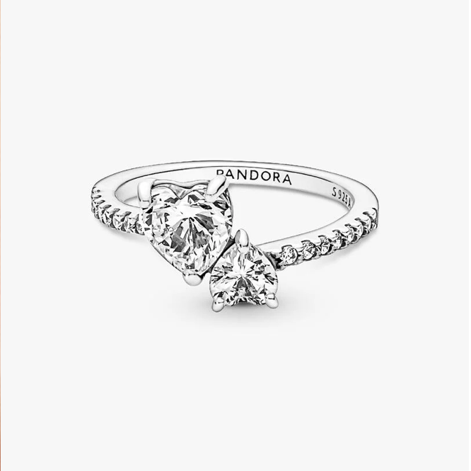 A silver Pandora ring with heart-shaped clear gemstones on a clean white background.